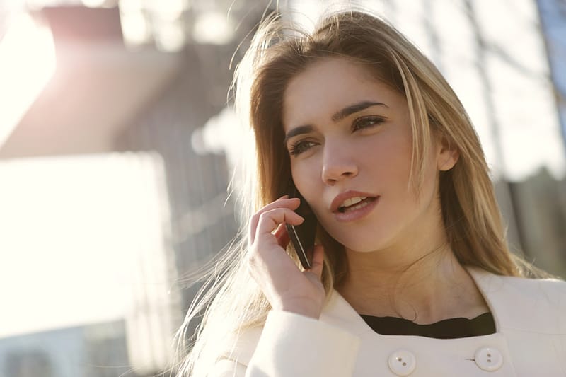 woman speaking on smartphone