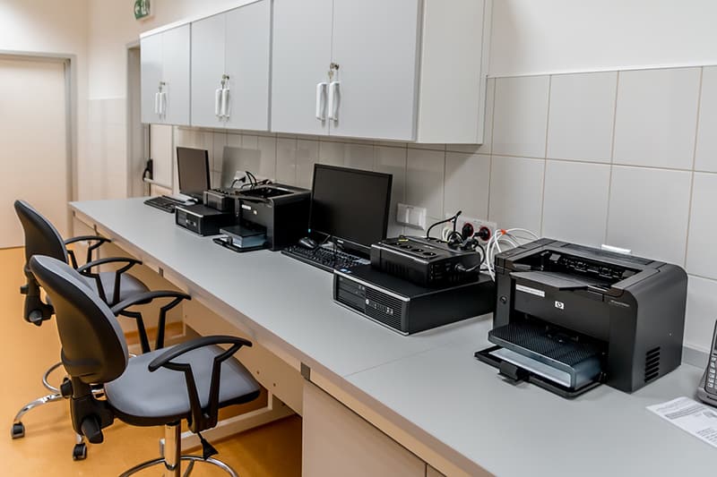 office equipment on worktop - including printers, monitors and  computers