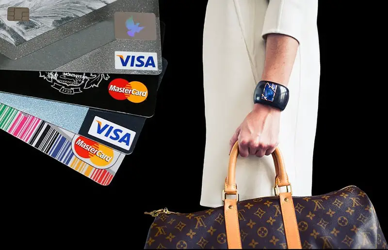 credit cards and someone holding bag