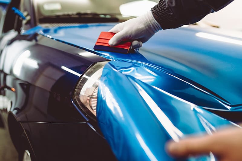 Car getting a vinyl wrap applied