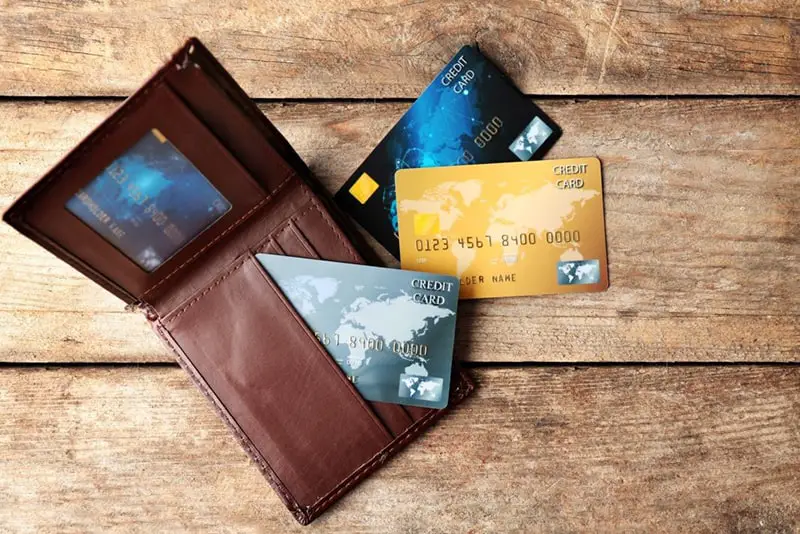 Credit cards and wallet on wooden table