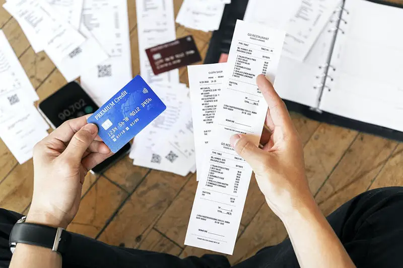 man keeping track of his expenses and digital bank transactions