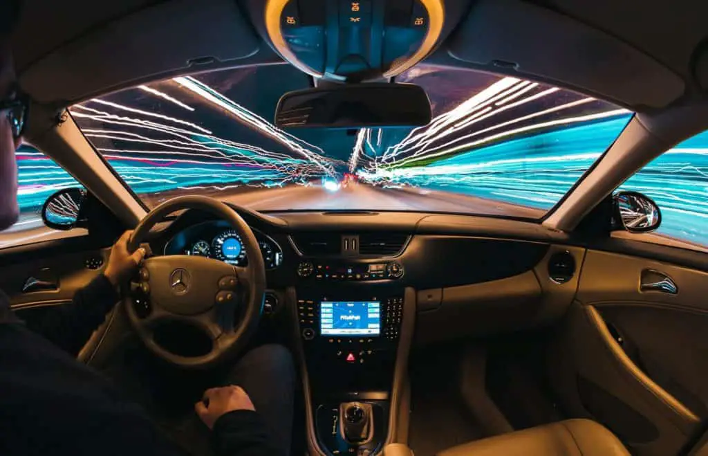 Man driving car - long exposure image nightime and light