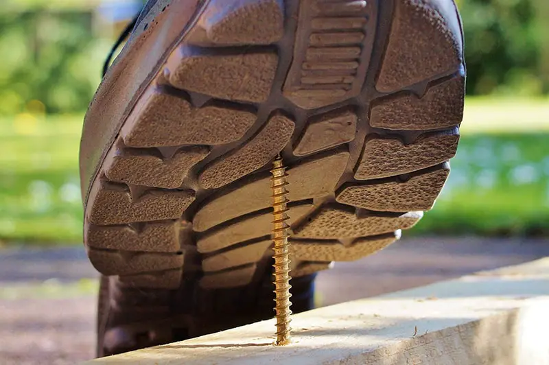 personal injury at work – about to step on screw sticking out of a piece of wood
