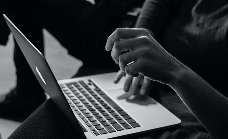 Person working online on laptop