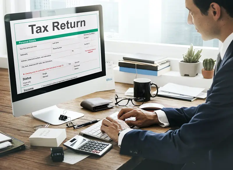 Income tax, tax return,  tax deduction form on computer screen