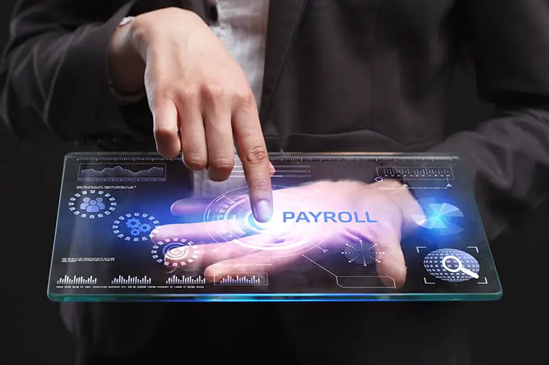 The concept of business, technology, the Internet and the network. A young entrepreneur working on a virtual screen of the future and sees the inscription: Payroll