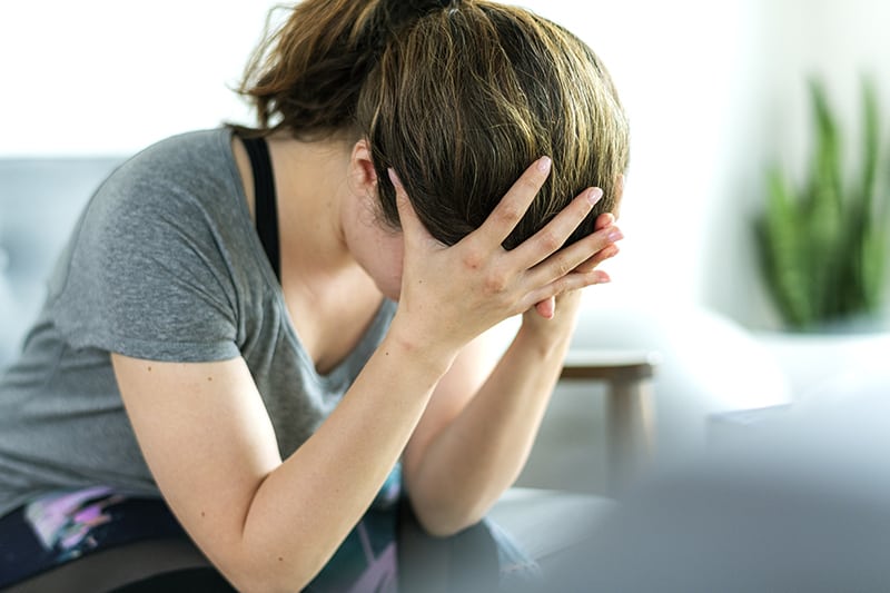 Emotionally stressed woman not feeling well