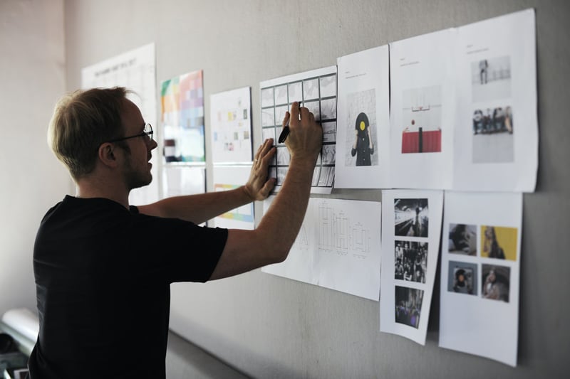 Entrepreneur working on business strategy board