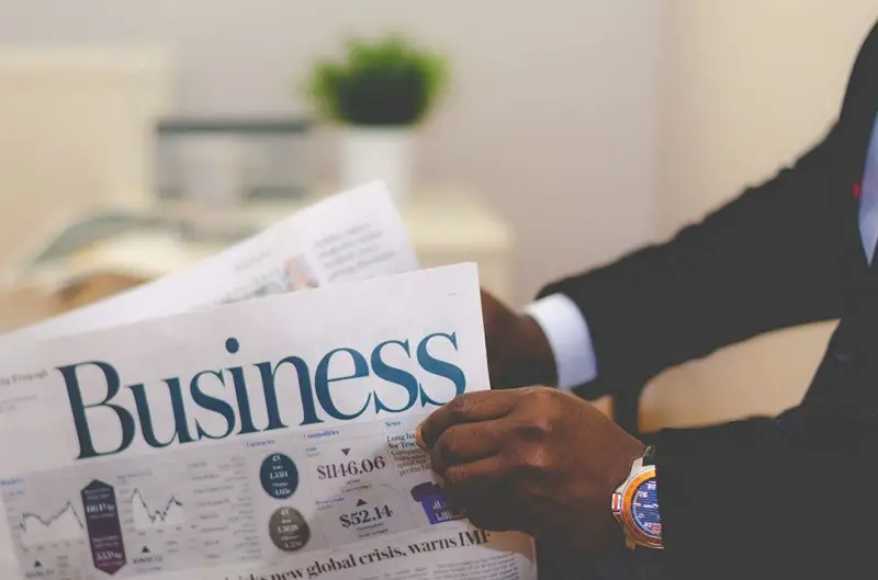 A man reading a business news paper