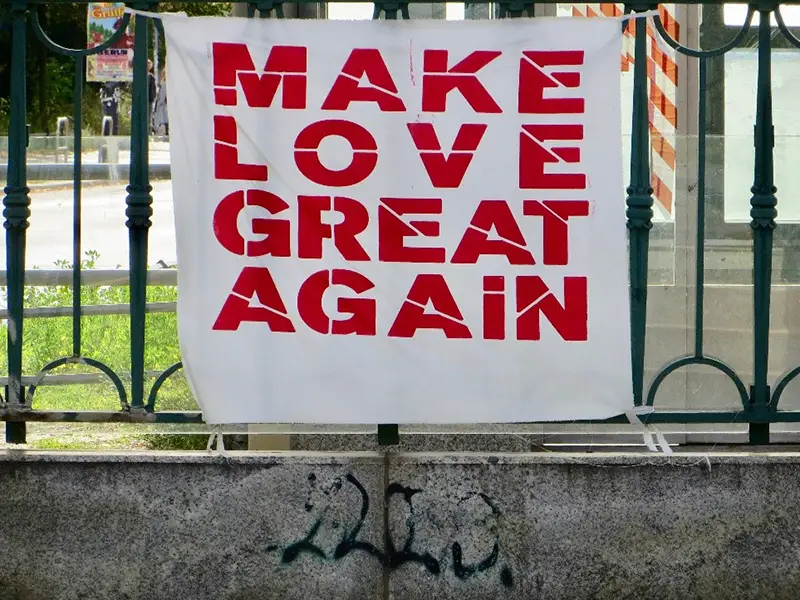 A red text banner attached in the fence