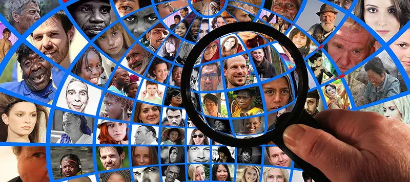 Faces of different people and a magnifying glass