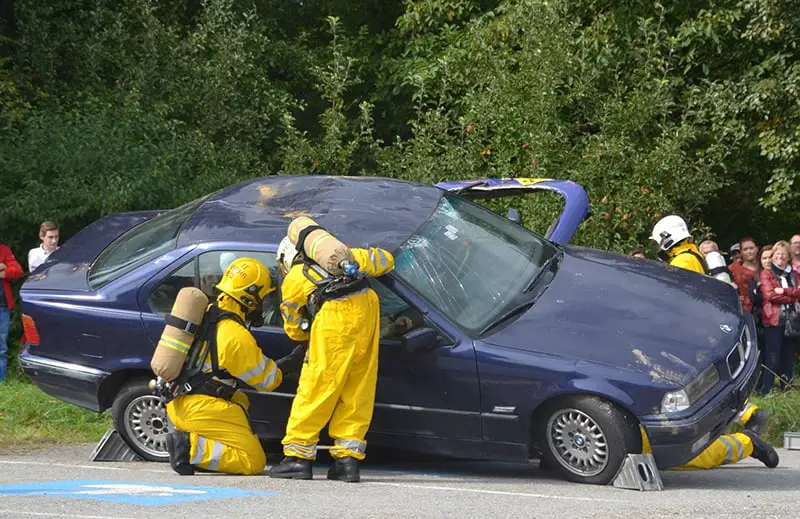 A blue car accident in the road