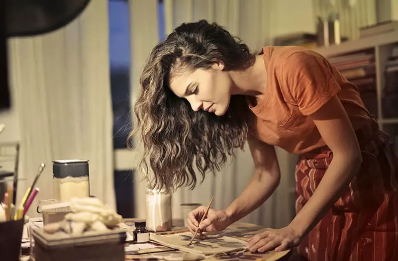 A female artist drawing in workshop