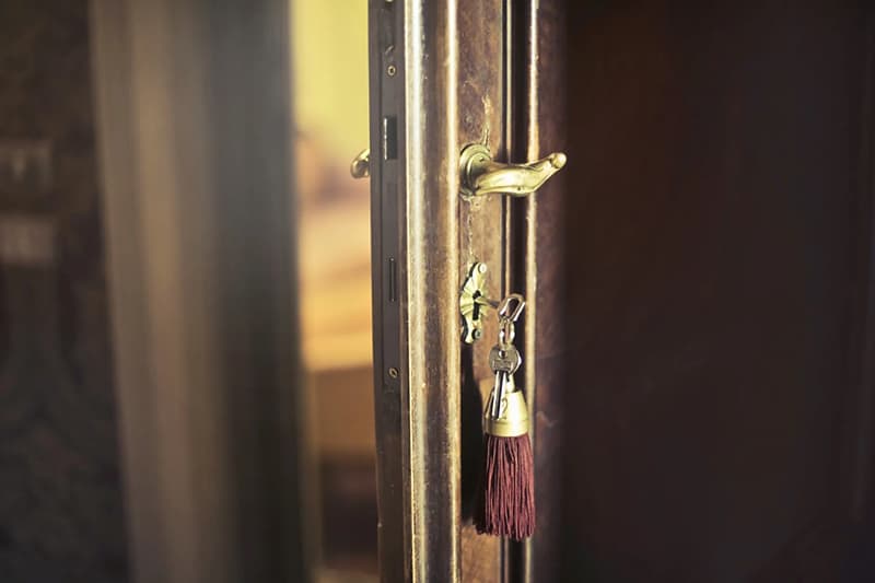 keychain key in a cabinet door