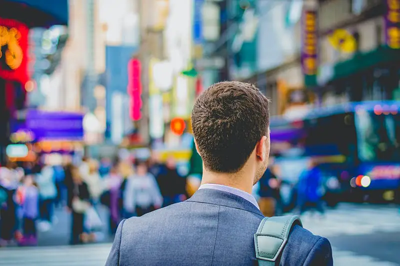 shallow photography of a man in suit jacket's back photo