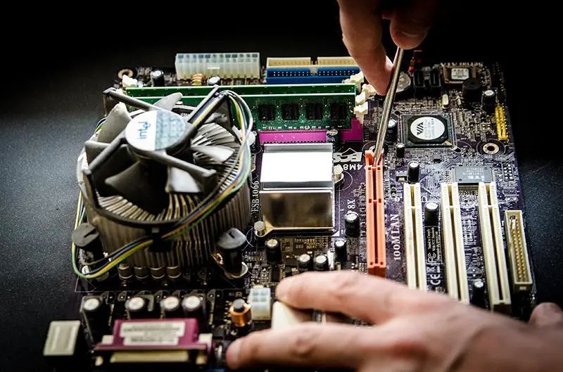 computer repair professional at work repairing a computer