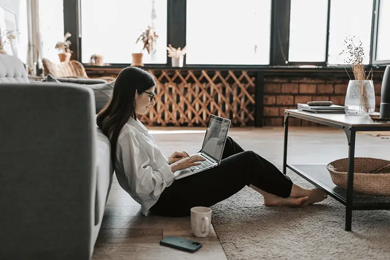 A woman working at home with her laptop