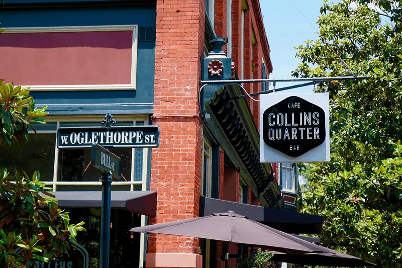 A black and white signage of cafe bar