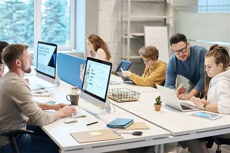 Group of people working in front of the computer