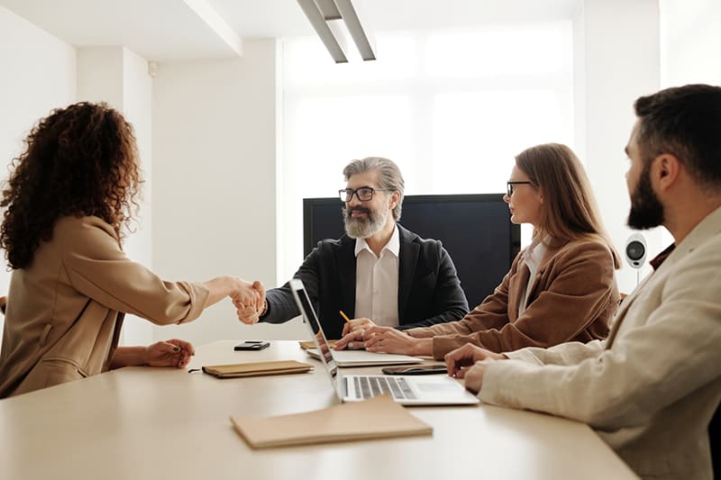 Four people in a business meeting