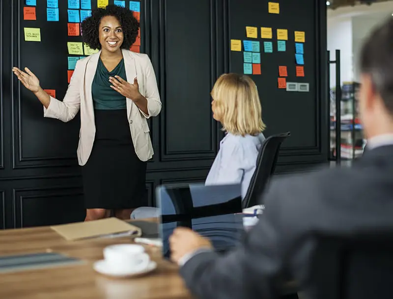 Woman in presentation speaking to her audience