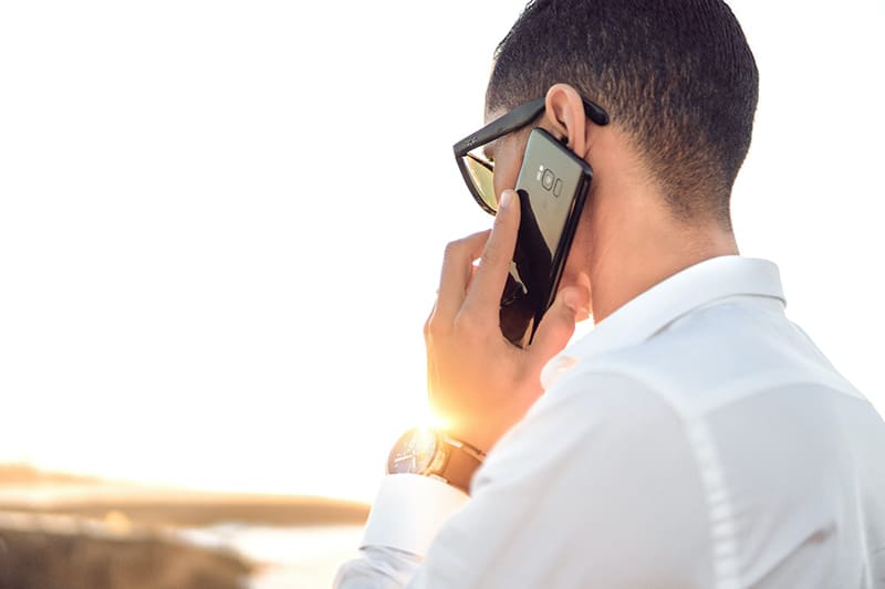 A business leader making a phone call