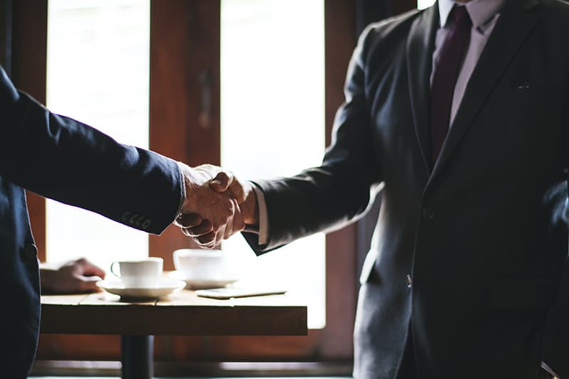 A client and customer doing a handshake