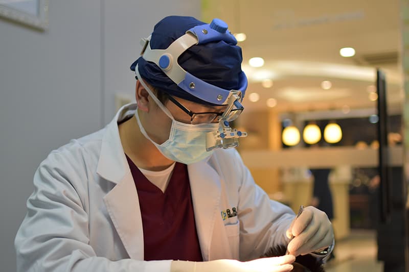 man wearing mask and head light