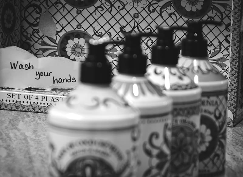 black and white image of soap bottles container