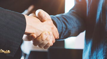 Business people shaking hands in the office.