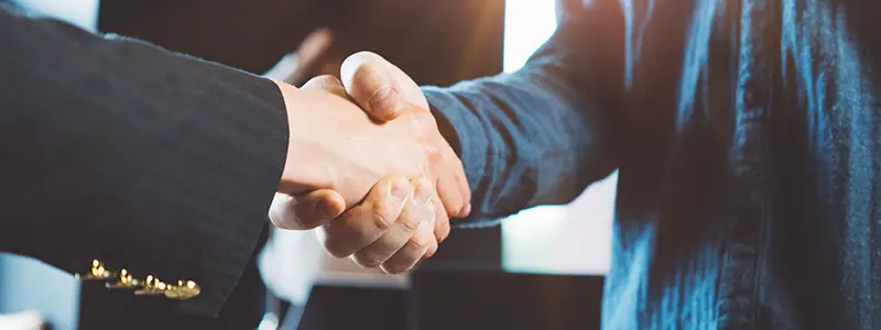 Business people shaking hands in the office.