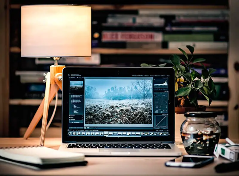 Macbook Pro on brown wooden table