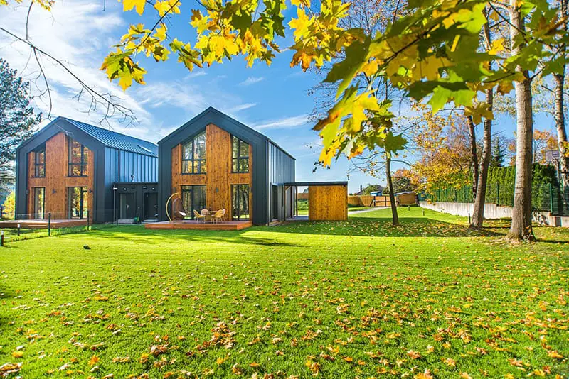 Beautiful wooden houses with lawn