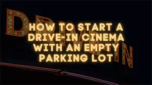 Drive in signage in neon color with black background