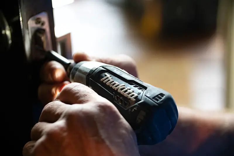 person making home improvements with Makita drill