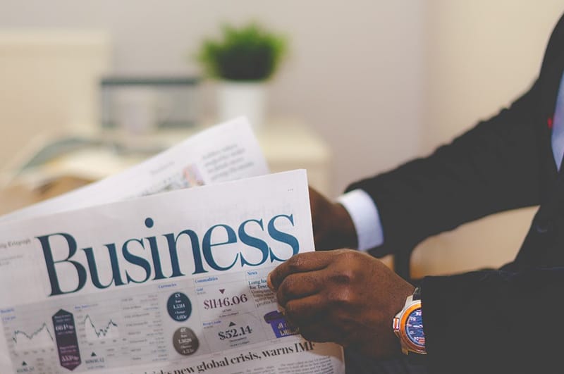 A businessman reading a business newspaper