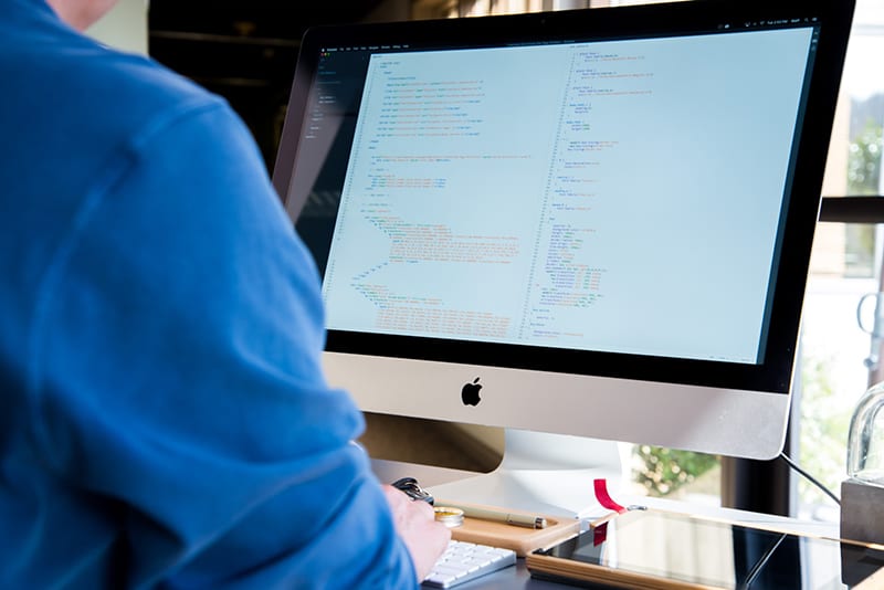 Person facing monitor while typing