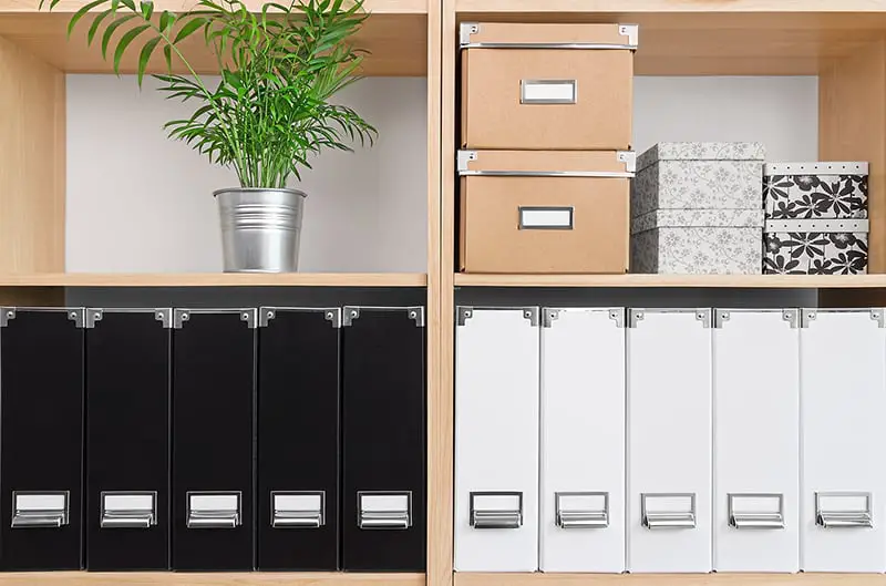 cardboard storage boxes on shelf unit