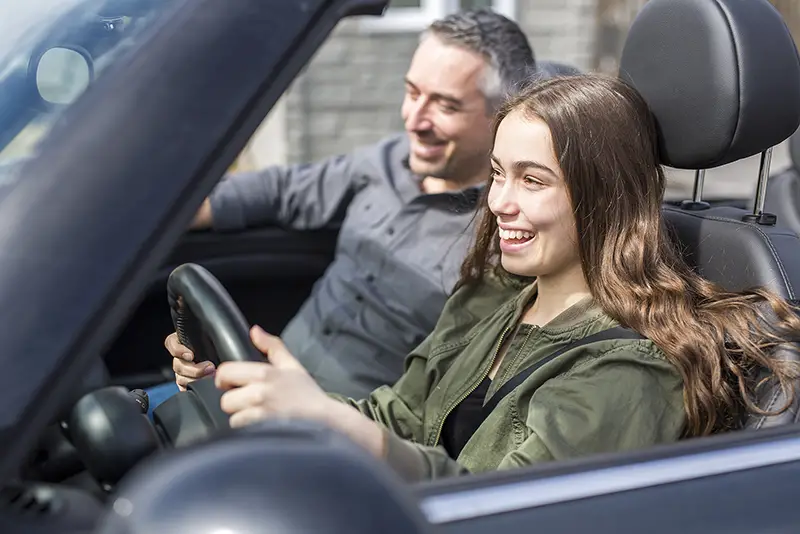 Teen learning drive taking driving test