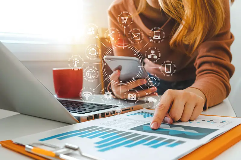 Businesswoman working on her laptop and smartphone