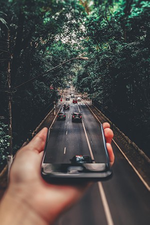 Perpective photography of cars running on road 