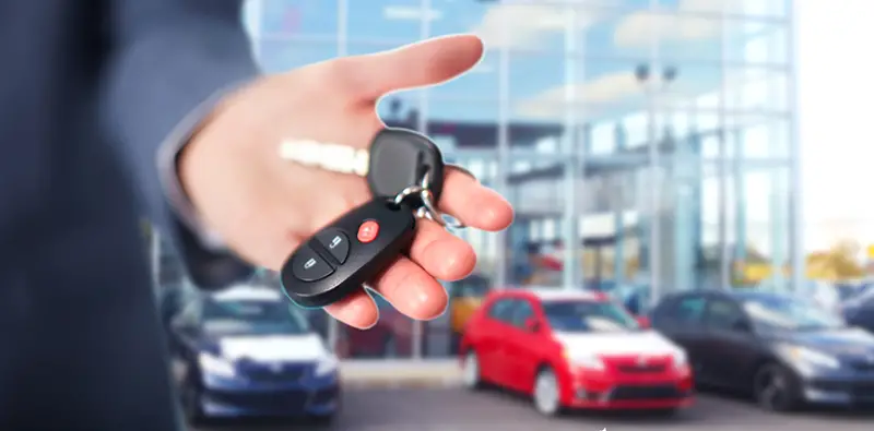 Hand of a person holding car keys