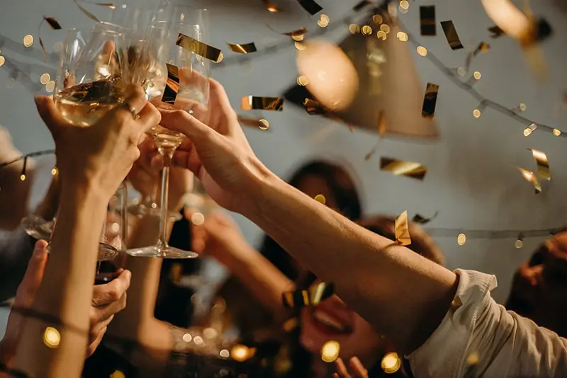 People toasting wine glasses