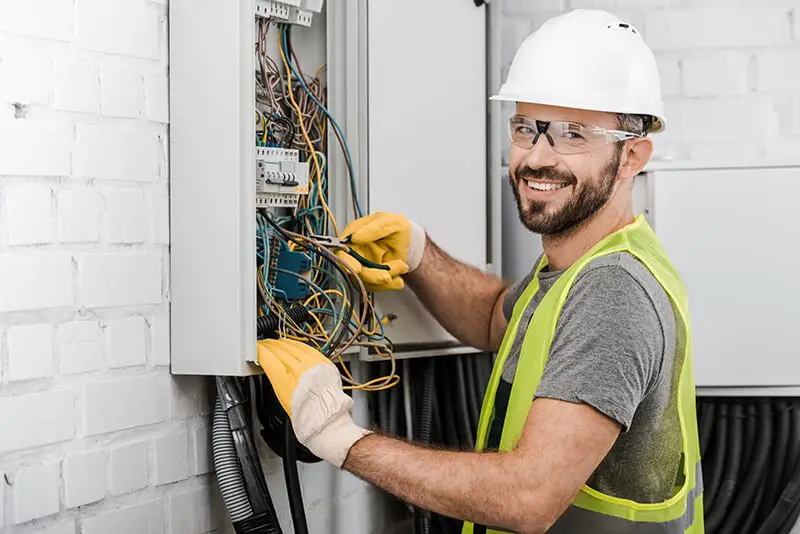 An electrician working with the wires