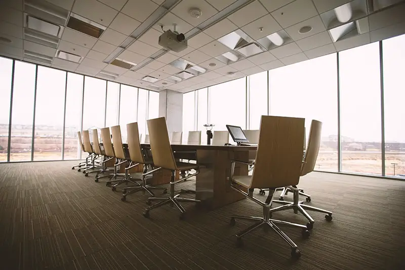 Brown chairs and table in conference room