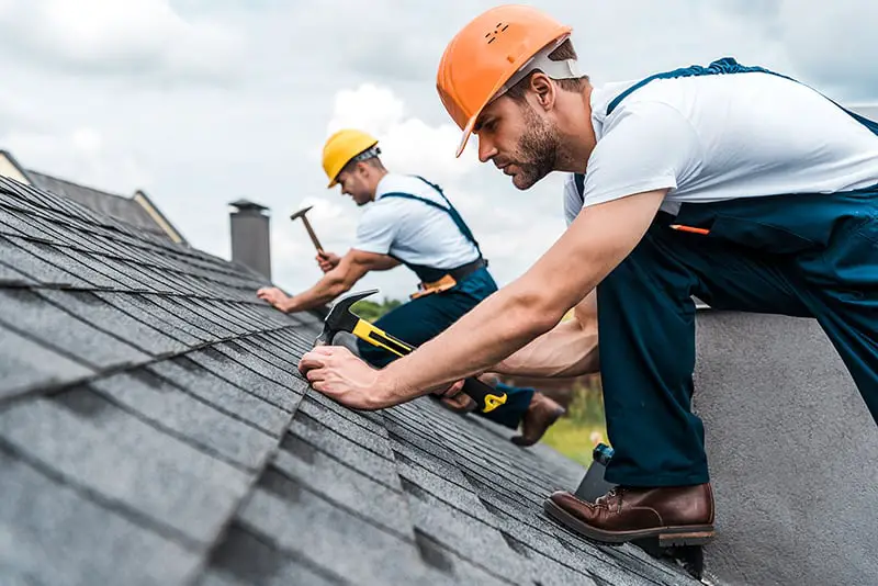 roofing contractors fixing new roofing