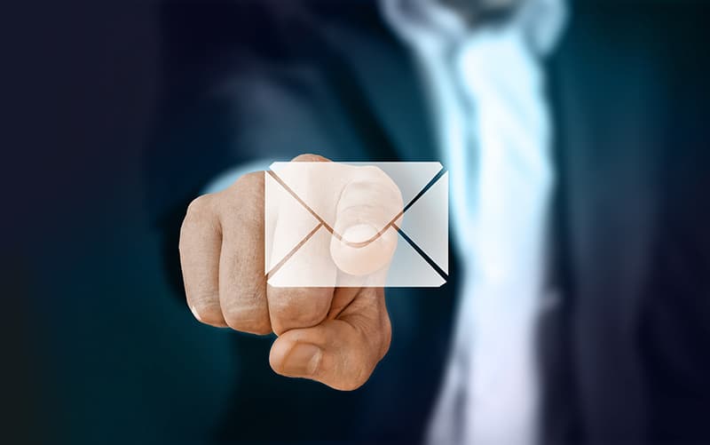 Businessman pointing email icon