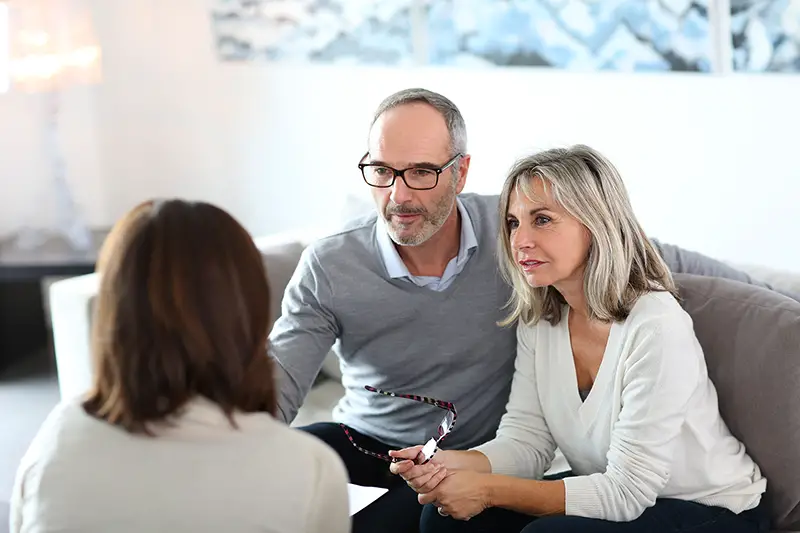 Senior couple meeting financial adviser for retirement planning