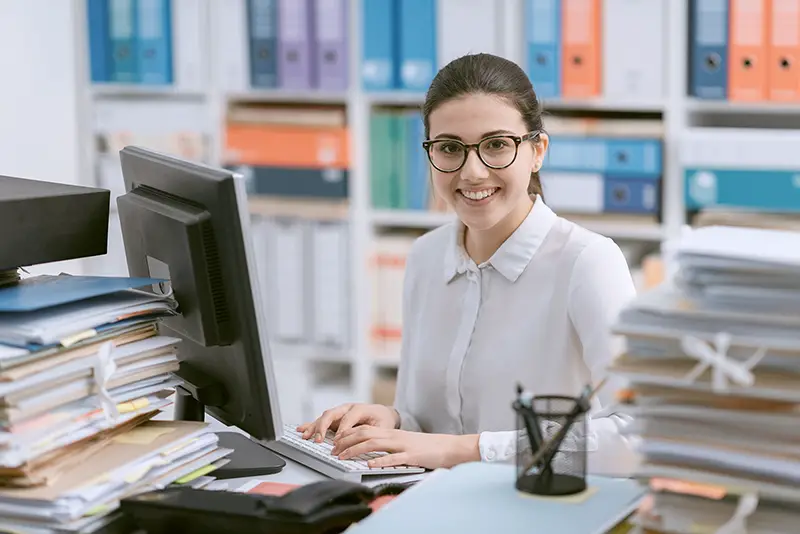 Young happy woman working in an accounting firm